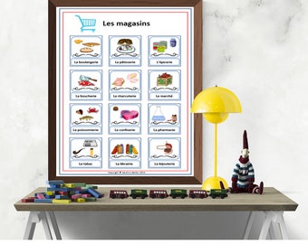May include: A colourful chart with the French word "Les magasins" at the top, meaning "The stores".  The chart features 12 different stores, each with a picture and the French name of the store.  The stores include a bakery, a pastry shop, a grocery store, a butcher shop, a delicatessen, a market, a fish market, a candy store, a pharmacy, a tobacco shop, a bookstore, and a jewellery store.