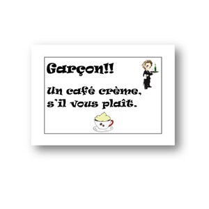 May include: A white sign with black text that says "Gar&ccedil;on!! un caf&eacute; cr&egrave;me, s'il vous pla&icirc;t."  There is a cartoon image of a waiter holding a tray with a glass of wine and a small cup of coffee with whipped cream.