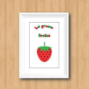 May include: A white framed print with the text "La grosse fraise" in red and green letters. A red and green cartoon strawberry is below the text.