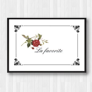 May include: A black and white printable art print with a red rose and green leaves in a decorative frame. The text "La favorite" is written in black cursive script.