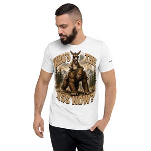Who's The Ass Now? Funny Bigfoot Shirt | Donkey Riding Sasquatch T-Shirt | Camping Humor Tee | Funny Outdoor Shirt | Cryptid Gift For Men