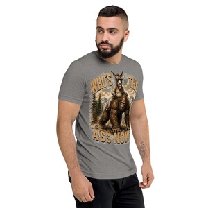 Who's The Ass Now? Funny Bigfoot Shirt | Donkey Riding Sasquatch T-Shirt | Camping Humor Tee | Funny Outdoor Shirt | Cryptid Gift For Men