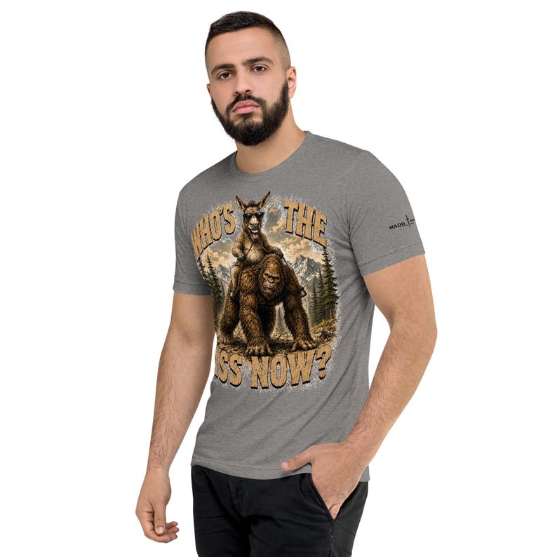 Who's The Ass Now? Funny Bigfoot Shirt | Donkey Riding Sasquatch T-Shirt | Camping Humor Tee | Funny Outdoor Shirt | Cryptid Gift For Men