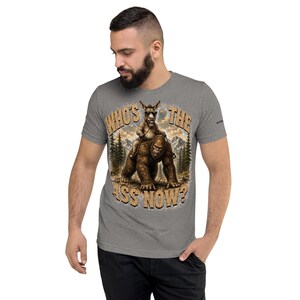 Who's The Ass Now? Funny Bigfoot Shirt | Donkey Riding Sasquatch T-Shirt | Camping Humor Tee | Funny Outdoor Shirt | Cryptid Gift For Men