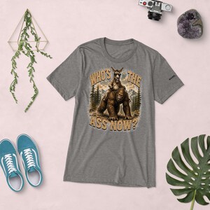 Who's The Ass Now? Funny Bigfoot Shirt | Donkey Riding Sasquatch T-Shirt | Camping Humor Tee | Funny Outdoor Shirt | Cryptid Gift For Men