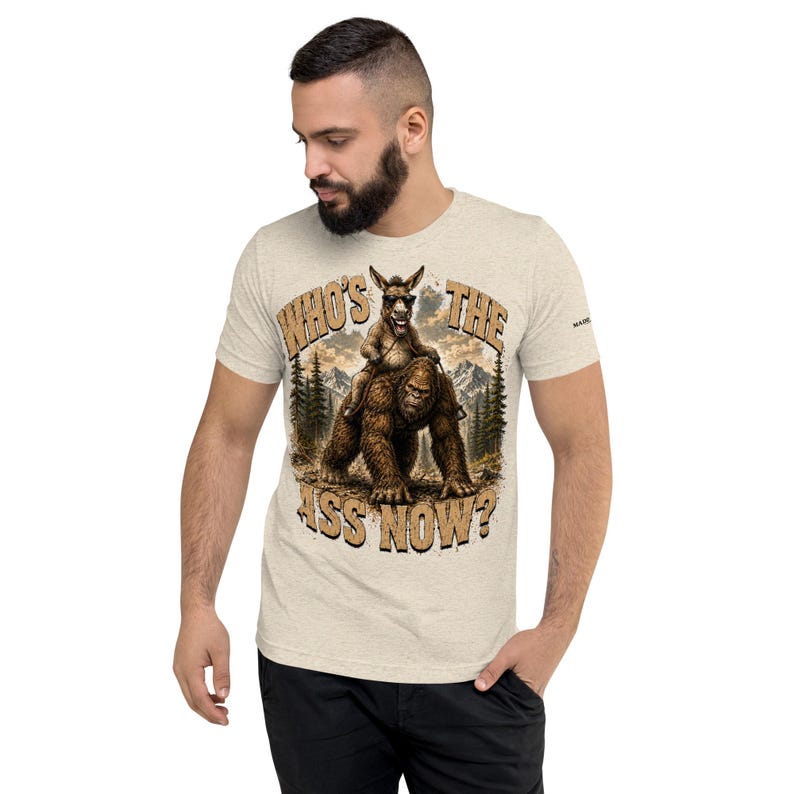 Who's The Ass Now? Funny Bigfoot Shirt | Donkey Riding Sasquatch T-Shirt | Camping Humor Tee | Funny Outdoor Shirt | Cryptid Gift For Men