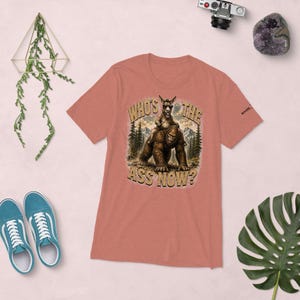 Who's The Ass Now? Funny Bigfoot Shirt | Donkey Riding Sasquatch T-Shirt | Camping Humor Tee | Funny Outdoor Shirt | Cryptid Gift For Men
