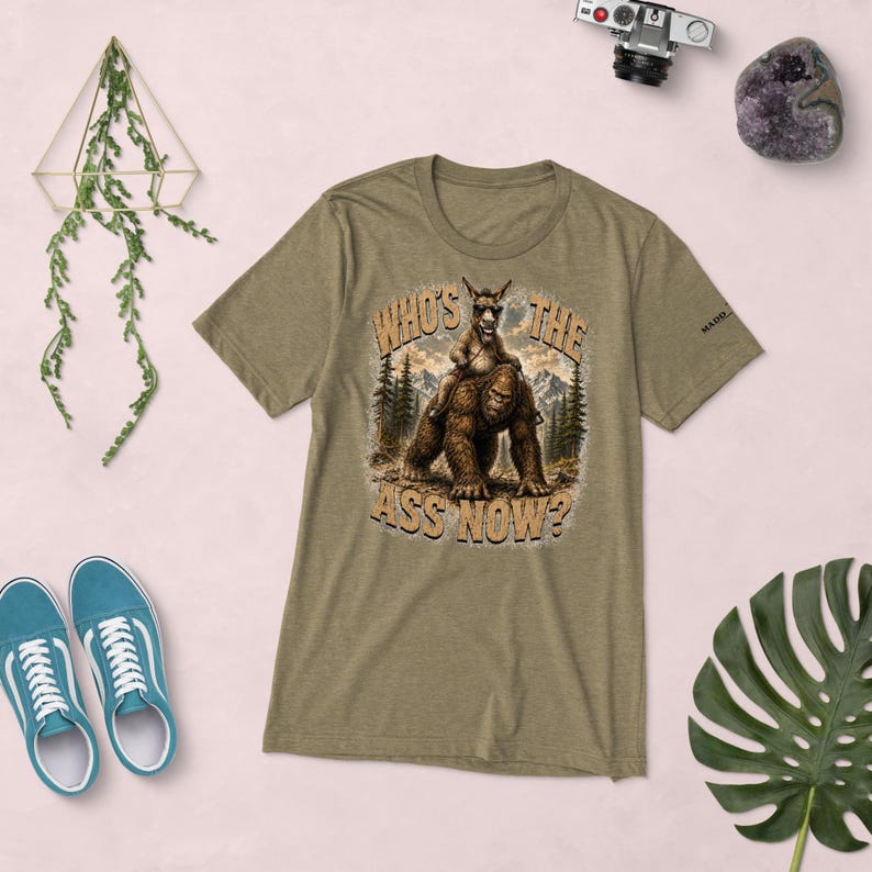 Who's The Ass Now? Funny Bigfoot Shirt | Donkey Riding Sasquatch T-Shirt | Camping Humor Tee | Funny Outdoor Shirt | Cryptid Gift For Men