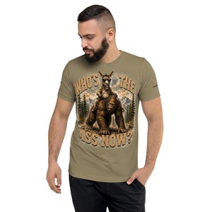 Who's The Ass Now? Funny Bigfoot Shirt | Donkey Riding Sasquatch T-Shirt | Camping Humor Tee | Funny Outdoor Shirt | Cryptid Gift For Men