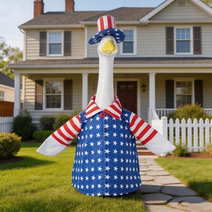 May include: A white goose wearing a patriotic outfit, including a blue jacket with white stars, a red and white striped collar, and a matching top hat. The goose stands on a green lawn in front of a house.