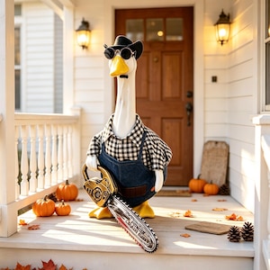 May include: A white goose figurine wearing a black cowboy hat, round sunglasses, a black and white checkered shirt, and blue denim overalls. The goose holds a metallic-colored toy chainsaw with the text Power Chain Grip on the blade.