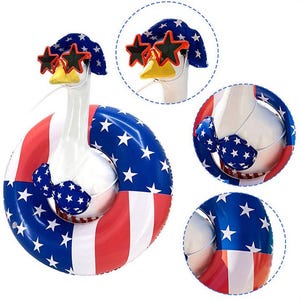 May include: An inflatable goose wearing star-shaped sunglasses, a blue and white star-patterned hat, and a matching bikini. The goose is floating in a red, white, and blue striped inflatable ring, perfect for a patriotic summer celebration.