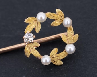 Broche antiguo de oro de 14 quilates: joyería victoriana con diamantes y perlas.
