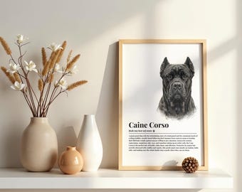 May include: A framed wall art print featuring a black and white sketch of a Cane Corso dog with the text Caine Corso and a dictionary-style definition below the image. The print is displayed in a light wood frame on a white shelf.