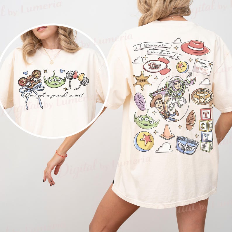 May include: Cream-coloured t-shirt with colourful cartoon graphics from the film Toy Story. The front displays the text "You got a friend in me!" with character illustrations. The back showcases more character art, including Buzz Lightyear and Woody.