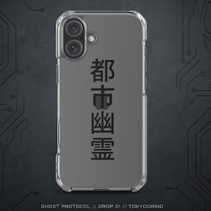 May include: Clear phone case with a black design featuring Japanese characters. The case has a dual-lens camera cutout and the text "GHOST PROTOCOL // DROP 01 // TOKYOGRIND" at the bottom.
