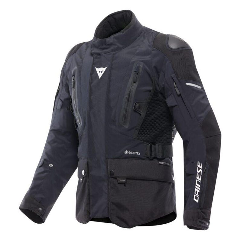 May include: A black motorcycle jacket with multiple pockets, zips, and a high collar. The jacket features the Dainese logo on the chest and sleeve, and the Gore-Tex logo. The jacket has reinforced shoulder pads and a mesh panel for ventilation.
