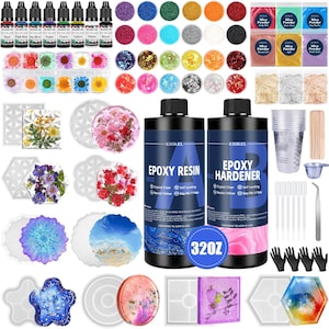 May include: A comprehensive epoxy resin kit with various components for crafting. Includes bottles of resin and hardener, alcohol inks, mica powders, molds, dried flowers, glitter, mixing cups, gloves, and tools. The kit is designed for DIY resin art projects.