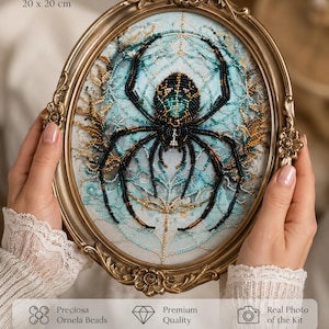 May include: An oval bead embroidery kit featuring a spider design in black, teal, and gold beads on a light blue background, encased in an ornate gold frame. The text reads Finished Size 7.9 x 7.9 inches, 20 x 20 cm, Preciosa Ornela Beads, Premium Quality, Real Photo of the Kit, Stunning Bead Embroidery Kit.