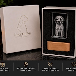May include: A white gift box featuring the Golden Tail Workshop logo with a dog silhouette and heart. Inside, a rectangular glass block displays a 3D laser-etched puppy portrait, accompanied by a light-toned wooden base set in black foam.