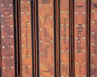 Any three books with leather covers.