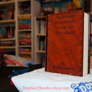 Leather covered copy of The Ultimate Hitchhiker&#39;s Guide by Douglas Adams