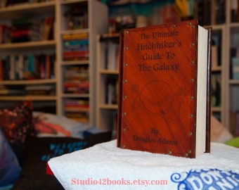 Leather covered copy of The Ultimate Hitchhiker's Guide by Douglas Adams