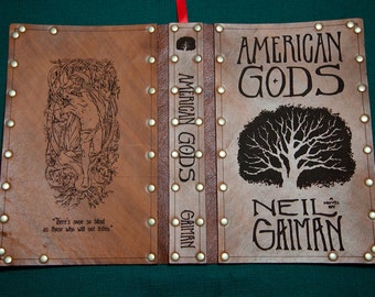 Leather covered copy of American Gods by Neil Gaiman.