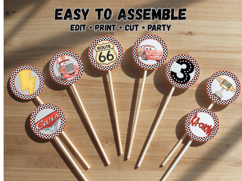 May include: A set of circular cupcake toppers on white sticks featuring racing-themed graphics including a Route 66 sign, a red race car, the number 3, a lightning bolt, and the text Cars and KA-CHOW. The text EASY TO ASSEMBLE EDIT PRINT CUT PARTY is visible.