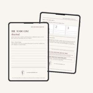 May include: Two digital tablets displaying a to-do list template. The tablet in the foreground shows a page titled "The To Do List Rewired" with lines for writing. The background tablet shows a page with numbered sections and prompts. Both have a cream background.