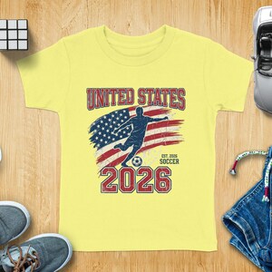 Yellow t-shirt with "United States Soccer" and US flag graphic.