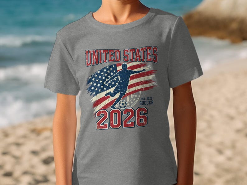 Grey t-shirt with "United States 2026" and soccer player silhouette.