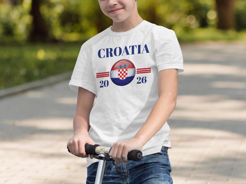 Boy in white t-shirt with Croatia 2026 text and flag design.