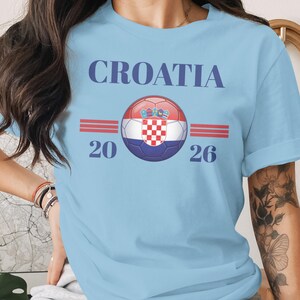Light blue t-shirt with "Croatia 20 26" and a Croatian flag soccer ball.