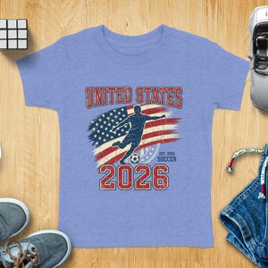 Soccer jersey with "UNITED STATES 2026" and American flag graphic.