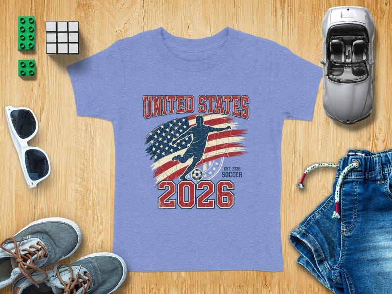 Soccer jersey with "UNITED STATES 2026" and American flag graphic.