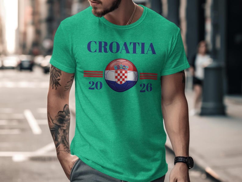 Green t-shirt with Croatia 2026 text and flag logo.