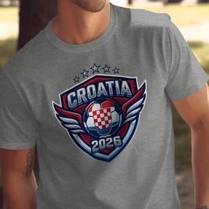 Grey t-shirt with Croatia 2026 soccer shield logo and checkered ball.