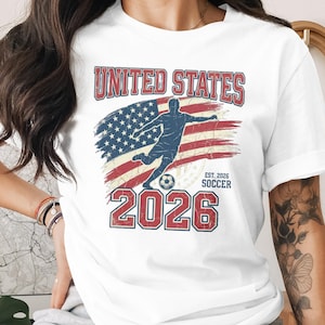 United States Soccer 2026 shirt with distressed American flag and player silhouette.