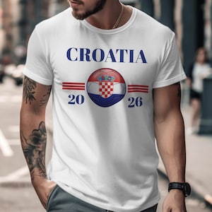 White t-shirt with Croatia flag soccer ball and "CROATIA 20 26" text.