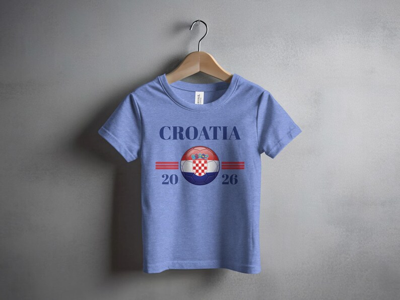 Blue t-shirt with "CROATIA 2026" and a Croatian flag emblem.