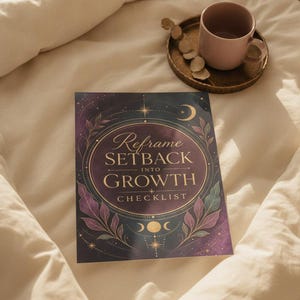 May include: A rectangular checklist titled Reframe SETBACK INTO GROWTH in gold lettering, featuring a purple and dark blue celestial background with gold stars, moons, and botanical illustrations, accompanied by a pink mug on a gold tray.