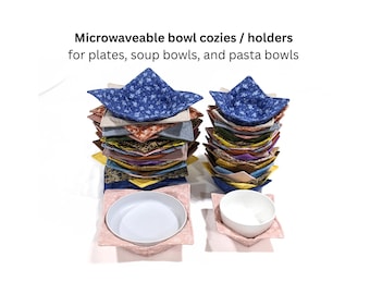 May include: Microwaveable bowl cozies / holders for plates, soup bowls, and pasta bowls. Two stacks of fabric bowl holders in various colors and patterns, including blue floral, solid pink, and earth tones, with two white bowls placed inside.