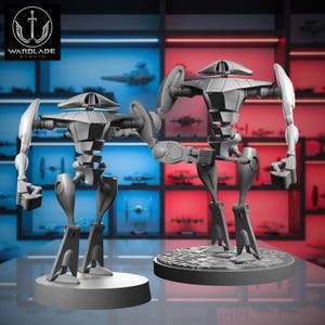 May include: Two gray robot figurines with articulated arms and legs, standing on circular bases. The robots have a sleek, futuristic design, with a rounded head and a detailed body. The background features a logo that says "WARDLADE STUDIO".