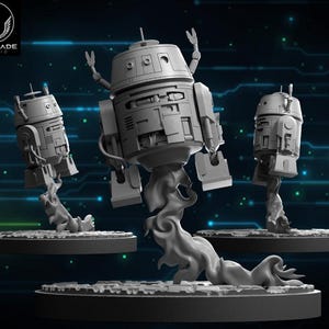 May include: Three gray robot figurines, each mounted on a circular base with a stylized smoke effect. The robots have a cylindrical head and rectangular body with detailed panels. The Wardlade Studio logo is in the upper left corner.