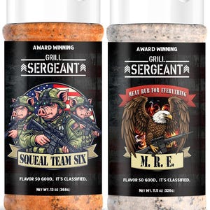 May include: Two plastic spice bottles with white flip-top lids. The left bottle contains orange seasoning, labeled Grill Sergeant Squeal Team Six, 13 oz (368g). The right bottle contains white seasoning, labeled Grill Sergeant M.R.E., 11.5 oz (326g).