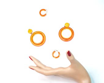 Vintage 1960s orange Lucite earrings set, two pairs round circle orb clip-on yellow mod formal mid-century pin-up jewelry