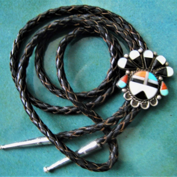 Zuni Sterling & Stone Bolo Tie.  Likely dates from 70's with Mild  Patina.  Combination of Sunshine Face and Kachina Design.