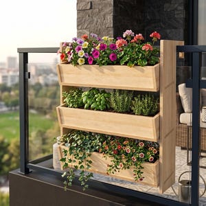 May include: A three-tiered wooden planter box filled with colorful flowers, herbs, and trailing plants. The top level features vibrant petunias, the middle level has basil and rosemary, and the bottom level showcases cascading greenery and small red flowers. The planter is on a balcony.