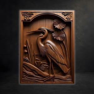 May include: A rectangular wooden wall plaque featuring a detailed relief carving of a heron standing among aquatic plants and lotus flowers. The artwork is framed by an arched border with decorative leaf motifs in the top corners, all in brown.